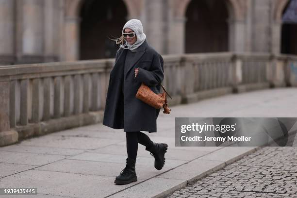 Sonia Lyson seen wearing H&M grey cable knit balaclava, Isabel Marant milky white sunglasses, Sporty & Rich grey wool knit sweater, COS grey...