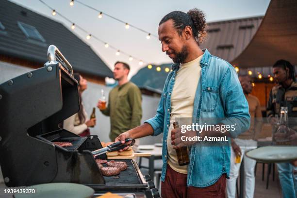 diverse group of people at outdoor barbecue party - utegrillat bildbanksfoton och bilder