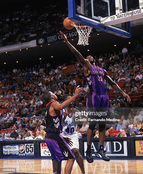 Mamadou N'diaye of the Toronto Raptors takes the shot during the game against the Orlando Magic at TD Waterhouse Center on April 9, 2003 in Orlando,...