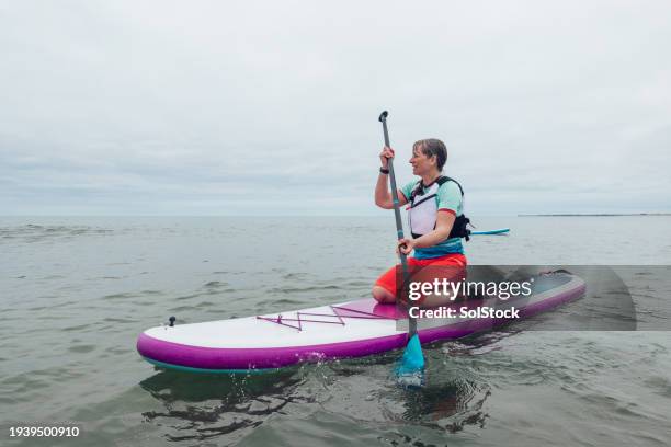 adventure at sea - paddleboard stock pictures, royalty-free photos & images