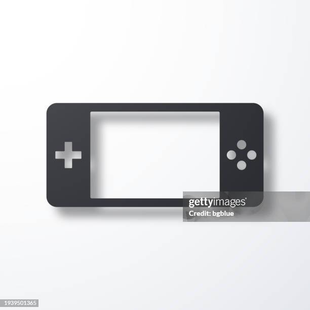handheld game console. icon with shadow on white background - gaming controller white stock illustrations