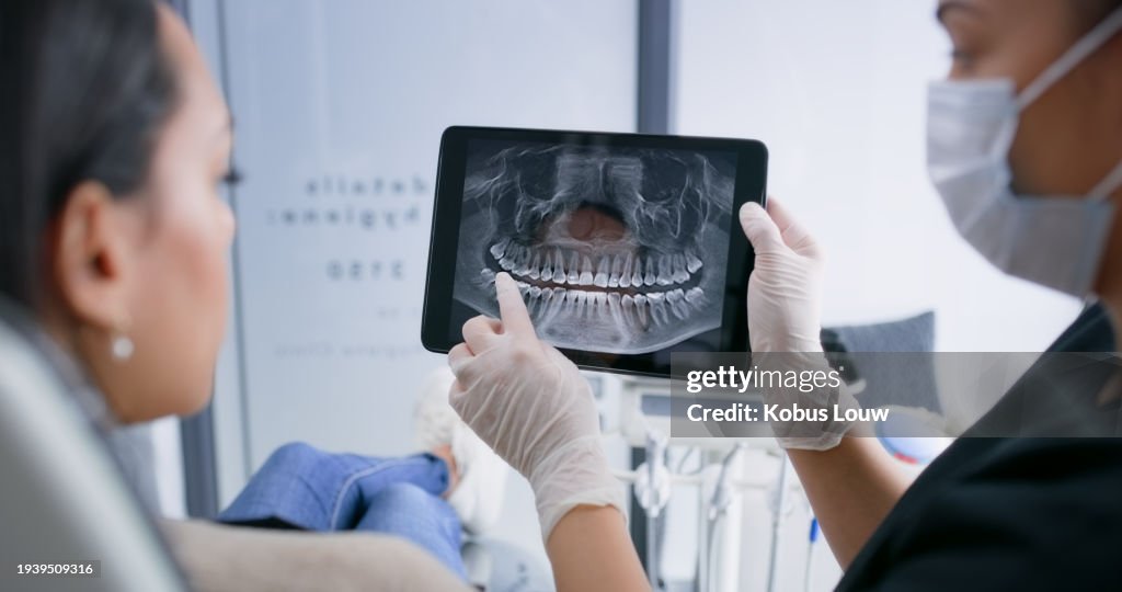 Hands, tablet and teeth xray, dentist and patient with dental surgery and health, people and orthodontics at clinic. Healthcare, wellness and digital scan of mouth on screen with cavity or gingivitis