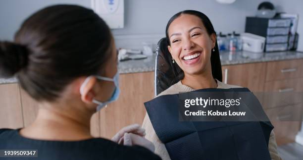 women, dentist and patient with smile, wellness and oral health, consultation and check mouth with orthodontics. people, medical treatment or professional with dental hygiene, clinic and clean cavity - equipamento dentário imagens e fotografias de stock