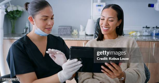 dentist, tablet results and discussion with woman patient for teeth cleaning or surgery at a clinic. dental info, doctor and healthcare with surgeon and health conversation in a hospital for wellness - tandhälsa bildbanksfoton och bilder