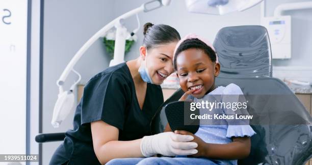 dentist, child and healthcare with mirror for dental service, teeth whitening and oral hygiene or consultation. dentistry, woman or kid patient for mouth wellness, tooth cleaning and implant checkup - dentista imagens e fotografias de stock