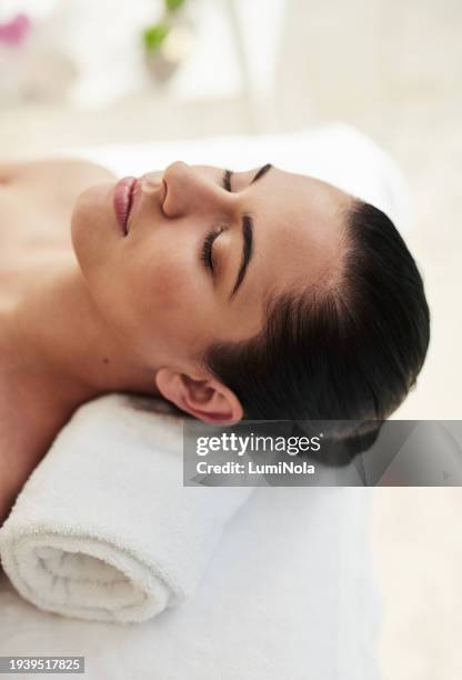 relax, aromatherapy and woman at luxury spa for massage, reiki service or sleep with holistic treatment. self care, peace and zen, girl on bed for facial wellness and alternative skincare at hotel. - spa treatment stock pictures, royalty-free photos & images