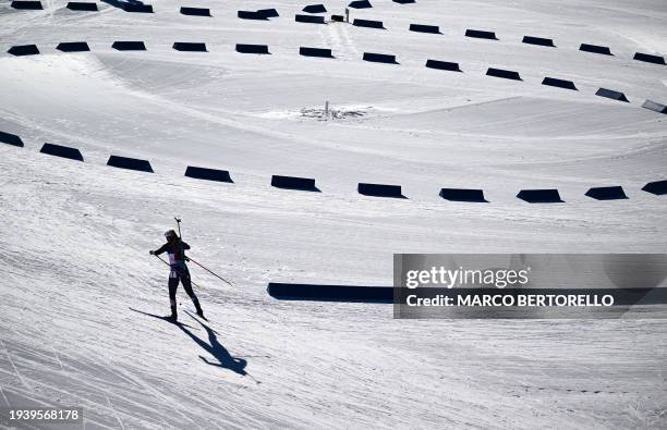 Norway's Ingrid Landmark Tandrevold skis during the Single Mixed Relay event of the IBU Biathlon World Cup of Antholz-Anterselva, South Tyrol in...