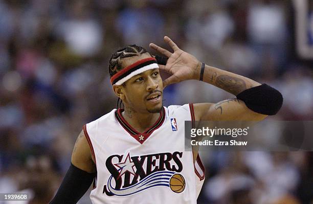 Allen Iverson of the Philadelphia 76ers gestures to hear cheers from the crowd during the NBA game against the Washington Wizards at First Union...