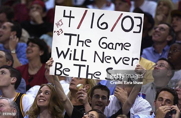 Fan acknowledges Michael Jordan of the Washington Wizards during the final NBA game of his career, played against the Philadelphia 76ers at First...