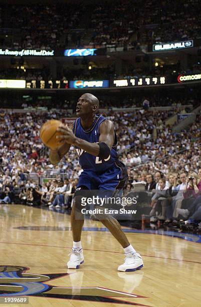 Michael Jordan of the Washington Wizards looks to shoot during the final NBA game of his career, played against the Philadelphia 76ers at First Union...