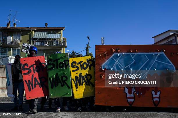 Demonstrators hold banners reading 'Stop War' during a protest against the presence of an Israeli pavillion at Vicenzaoro, the largest show in Europe...