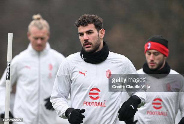 Theo Hernandez of AC Milan looks on during a AC Milan training session at Milanello on January 17, 2024 in Cairate, Italy.
