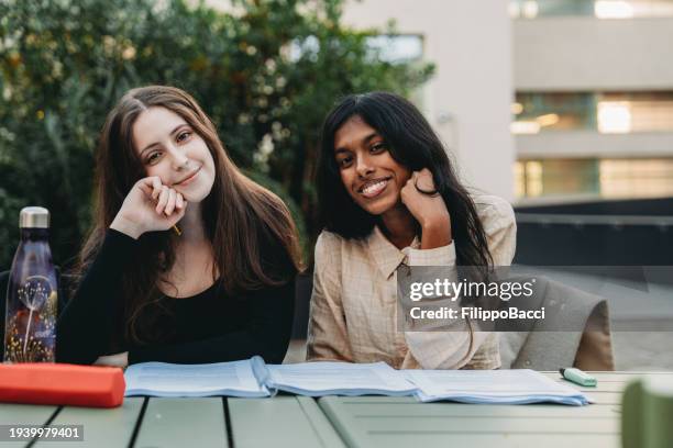 portrait of two friends while they are studying outdoor - sri lankan ethnicity stock pictures, royalty-free photos & images