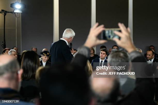 French Prime Minister Gabriel Attal attends a debate with the mayors and residents of the Rhone department, in Saint-Laurent d'Agny, central France,...