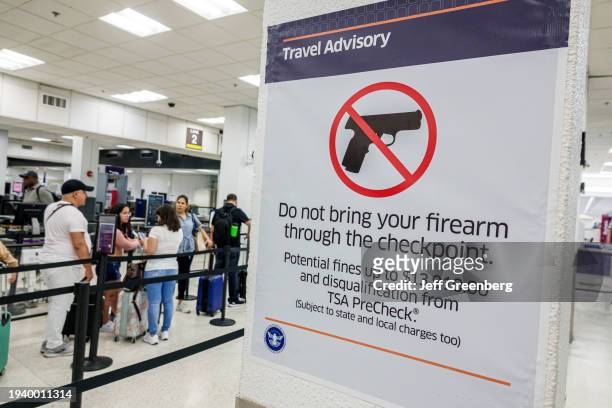 Miami, Florida, Miami International Airport, security screening, do not bring firearm through checkpoint.