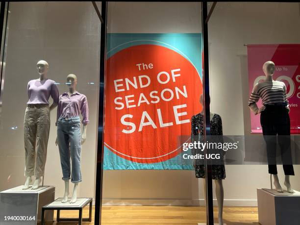 Ann Taylor Loft store window with End of Season Sale sign and mannequins, Queens, New York.