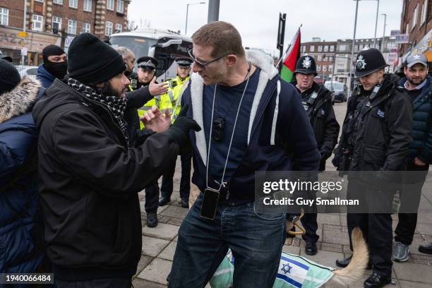 Pro Palestine and Jewish counter protestor argue outside the venue on January 17, 2024 in Hendon, England. A British IDF soldier returning from the...