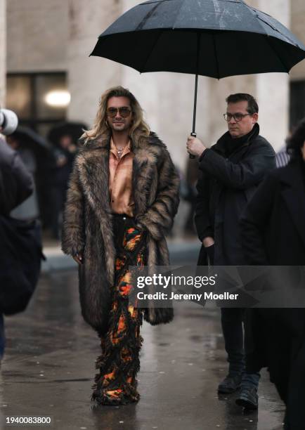 Bill Kaulitz seen wearing Gucci brown tortoise pilot sunglasses, gold piercings, gold earrings / hoops, gold necklaces, light orange satin / silk...