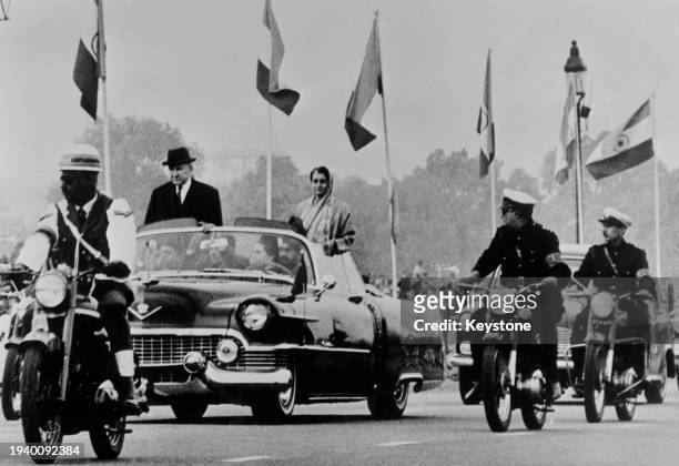 Russian politician Alexei Kosygin , Premier of the Soviet Union, and Indian politician Indira Gandhi , Prime Minister of India, in an open car as...