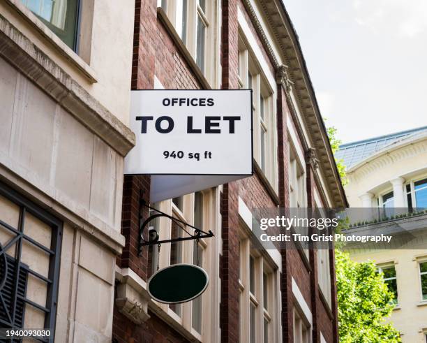 an 'offices to let' sign on the side of a building, london. uk. - job vacancy stock pictures, royalty-free photos & images