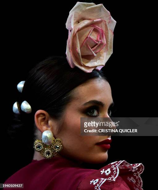 Model presents a creation by Alonso Cozar during the International Flamenco Fashion Week - SIMOF in Seville on January 20, 2024.