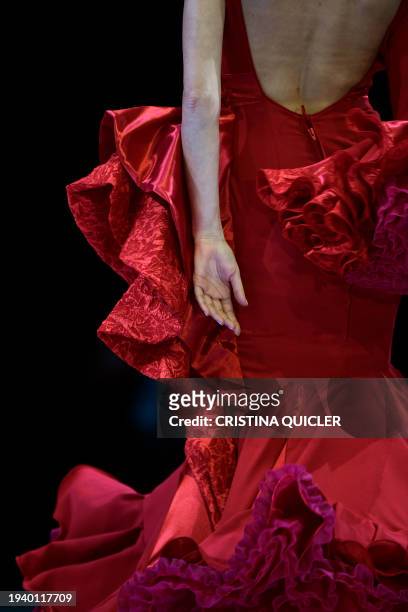 Model presents a creation by Yolanda Rivas during the International Flamenco Fashion Week - SIMOF in Seville on January 20, 2024.