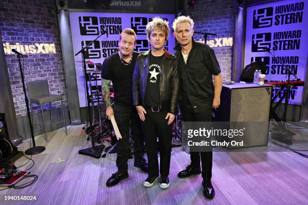 Tré Cool, Billie Joe Armstrong and Mike Dirnt of Green Day visit SiriusXM's 'The Howard Stern Show' at SiriusXM Studio on January 17, 2024 in New...
