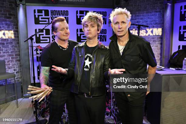 Tré Cool, Billie Joe Armstrong and Mike Dirnt of Green Day visit SiriusXM's 'The Howard Stern Show' at SiriusXM Studio on January 17, 2024 in New...