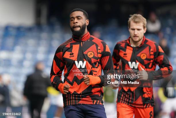Japhet Tanganga of Millwall warming up prior to the Sky Bet Championship match between Queens Park Rangers and Millwall at Loftus Road on January 20,...