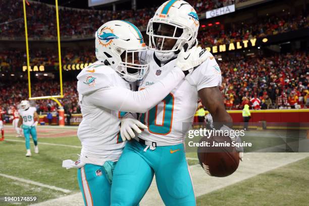Tyreek Hill of the Miami Dolphins celebrates with Jaylen Waddle after scoring a touchdown during the second quarter against the Kansas City Chiefs in...