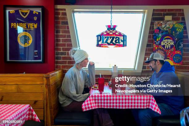 Bernadette and Austin Gonzales enjoy lunch at the dine-in Pizza Hut on Wednesday, Jan. 10, 2024 in Hempstead. The Hempstead Pizza Hut is one of the...