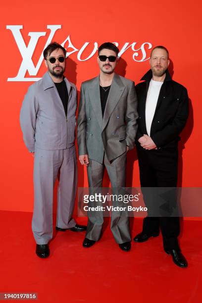 Ben Lovett, Marcus Mumford and Ted Dwane of the Mumford and Sons group attend the Louis Vuitton Menswear Fall/Winter 2024-2025 show as part of Paris...
