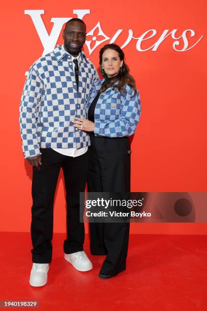 Omar Sy and Hélène Sy attend the Louis Vuitton Menswear Fall/Winter 2024-2025 show as part of Paris Fashion Week on January 16, 2024 in Paris, France.