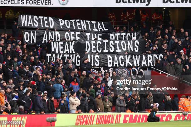 Crystal Palace fans hold up banners in response to their poor form during the Premier League match between Arsenal FC and Crystal Palace at Emirates...