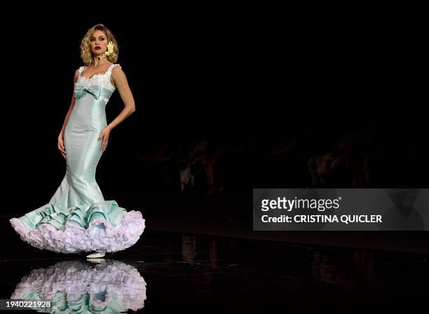 Model presents a creation by Juan Manolo during the International Flamenco Fashion Week - SIMOF in Seville on January 20, 2024.