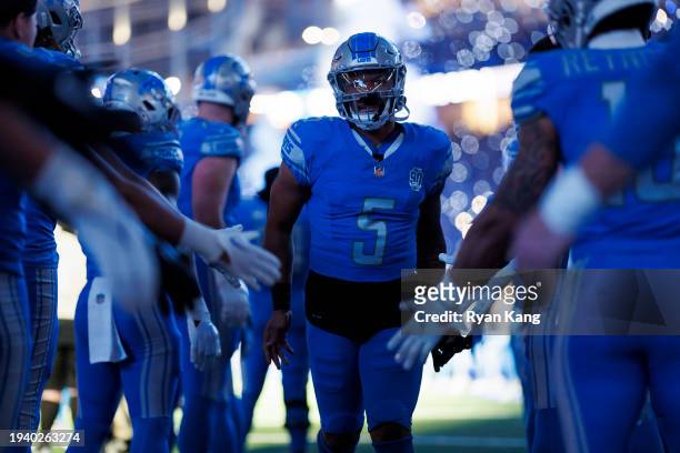David Montgomery of the Detroit Lions runs onto the field during player introductions prior to an NFC Wild Card Playoff football game against the Los...