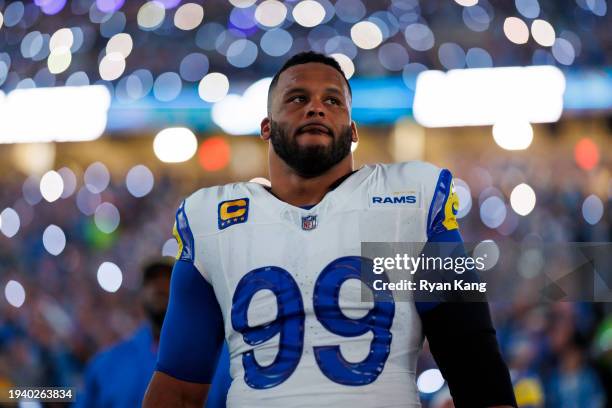 Aaron Donald of the Los Angeles Rams looks on from the sideline prior to an NFC Wild Card Playoff football game against the Detroit Lions at Ford...