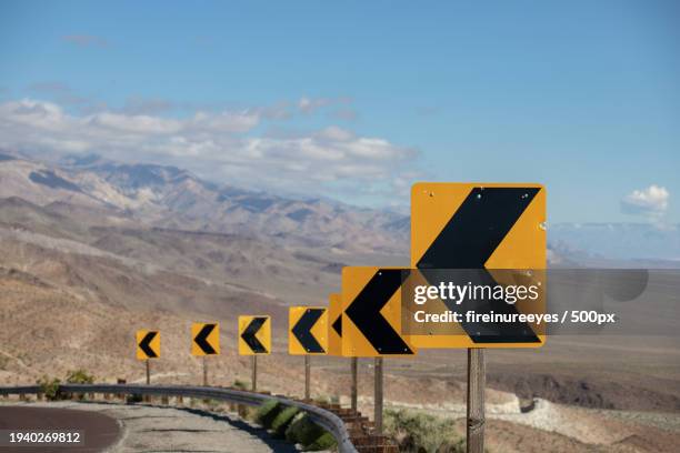 close-up of road sign against sky,death valley,california,united states,usa - señal de circulación fotografías e imágenes de stock