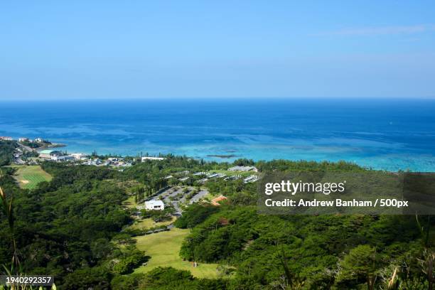 high angle view of sea against sky - okinawa blue sky beach landscape stockfoto's en -beelden
