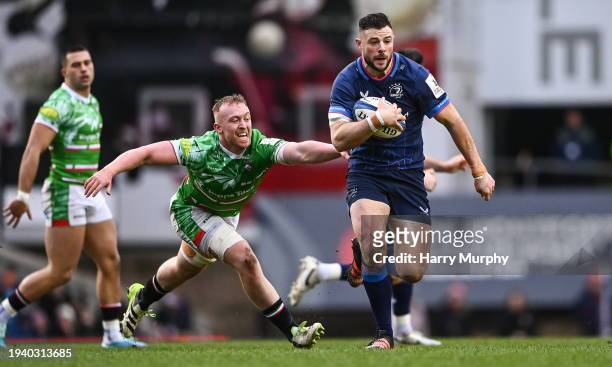 Leicester , United Kingdom - 20 January 2024; Robbie Henshaw of Leinster is tackled by Tommy Reffell of Leicester Tigers during the Investec...