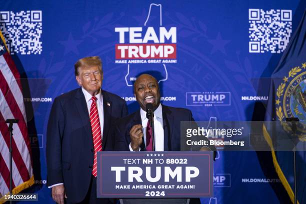 Senator Tim Scott, a Republican from South Carolina, right, speaks while standing next to former US President Donald Trump during a campaign event in...