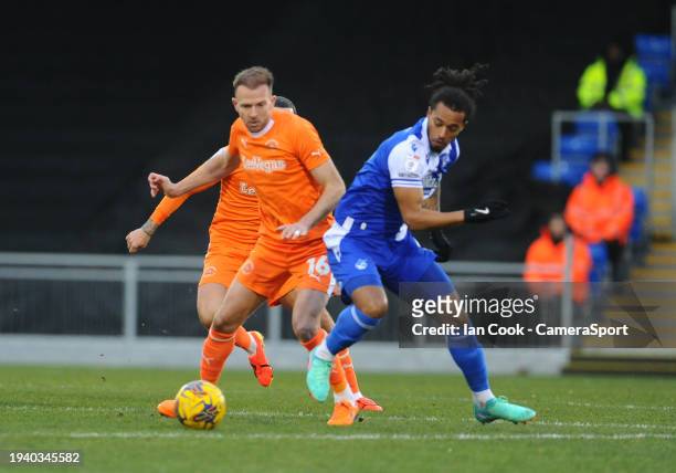Blackpool's Jordan Rhodes battles with Bristol Rovers' Josh Grant during the Sky Bet League One match between Bristol Rovers and Blackpool at...