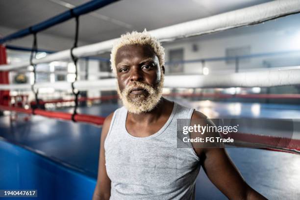 portrait of a boxer man on a boxing gym - amateur photo stock pictures, royalty-free photos & images