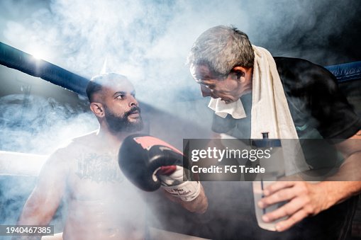 Boxing Coach Break Boxing Coach Instructing The Boxer On A Boxing Ring High-Res Stock ...