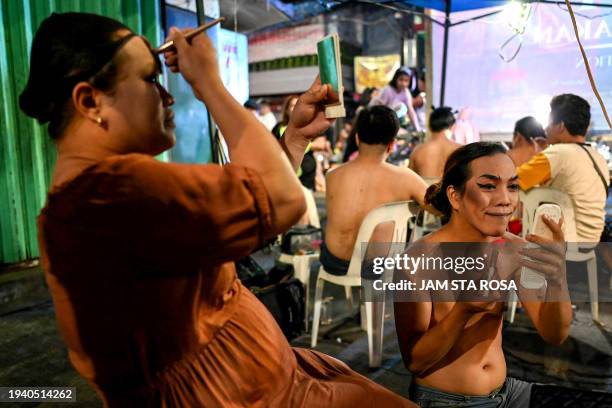 Contestants dress for a Miss Gay pageant, as their transgender community celebrates the Feast of Sto. Niño in Tondo, Manila on January 20, 2024.