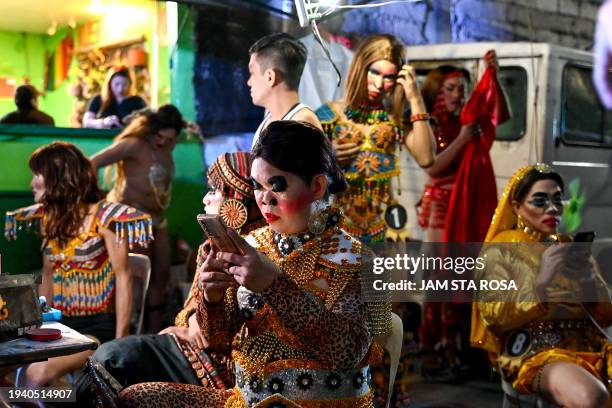 Contestants dress for a Miss Gay pageant, as their transgender community celebrates the Feast of Sto. Niño in Tondo, Manila on January 20, 2024.