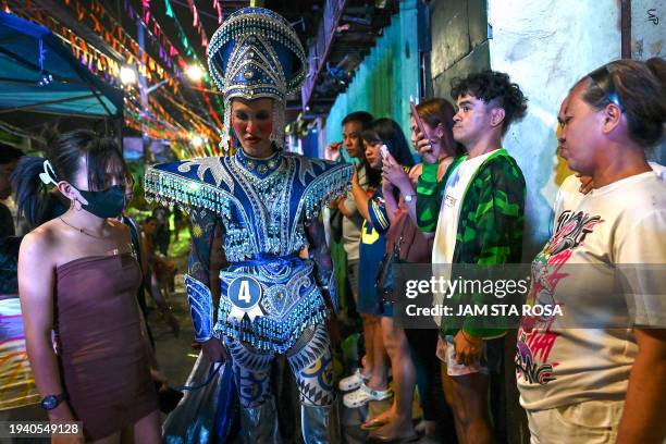 Contestant arrives at a Miss Gay pageant, as their transgender community celebrates the Feast of Sto. Niño in Tondo, Manila on January 20, 2024.