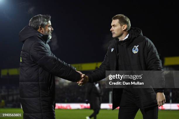 David Wagner, Manager of Norwich City, and Matt Taylor, Manager of Bristol Rovers, interact prior to the Emirates FA Cup Third Round Replay match...