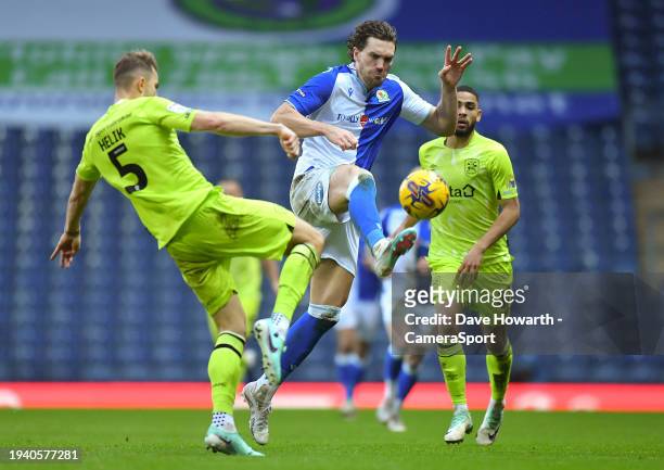 Blackburn Rovers' Sam Gallagher battles with Huddersfield Town's Micha Helik during the Sky Bet Championship match between Blackburn Rovers and...