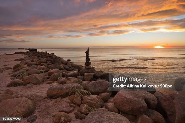 scenic view of sea against sky during sunset,pape,latvia - lettland landschaft stock-fotos und bilder
